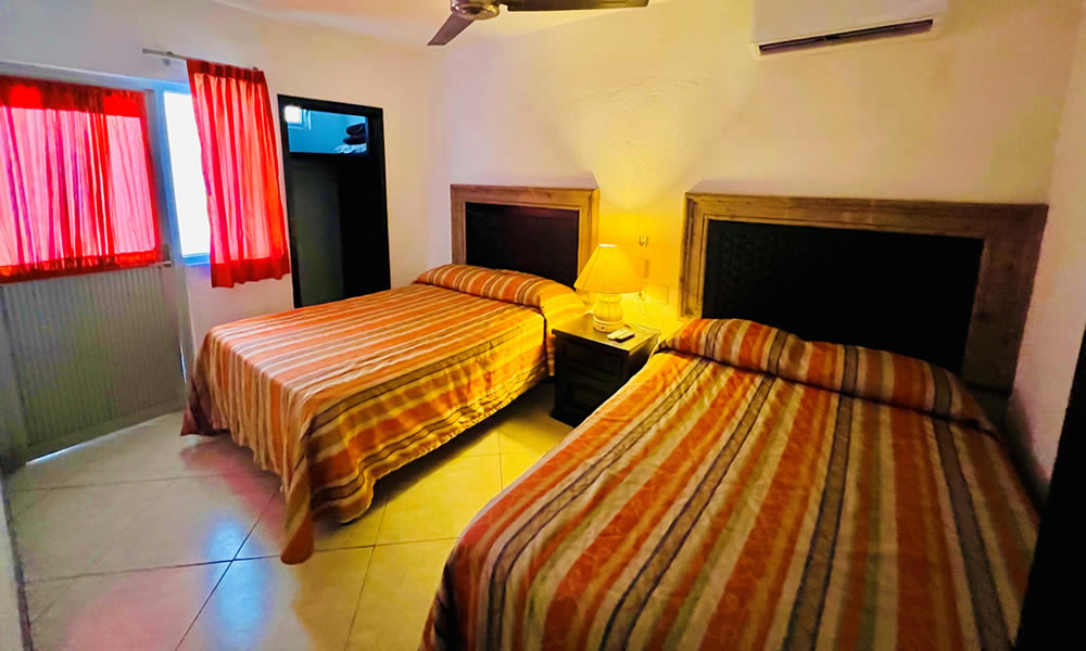 Suite 2 habitaciones con cocineta frente al mar - Dos camas matrimoniales